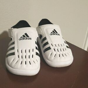 adidas White and Black Sandals with Slip-On Design and Breathable Material.